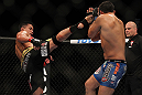 LAS VEGAS, NV - JULY 7:   Cung Le (left) kicks Patrick Cote during their middleweight bout at UFC 148 inside MGM Grand Garden Arena on July 7, 2012 in Las Vegas, Nevada.  (Photo by Josh Hedges/Zuffa LLC/Zuffa LLC via Getty Images)  *** Local Caption *** Cung Le; Patrick Cote