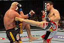 LAS VEGAS, NV - JULY 7:   (R-L) Forrest Griffin kicks Tito Ortiz during their light heavyweight bout at UFC 148 inside MGM Grand Garden Arena on July 7, 2012 in Las Vegas, Nevada.  (Photo by Donald Miralle/Zuffa LLC/Zuffa LLC via Getty Images)  *** Local Caption *** Tito Ortiz; Forrest Griffin