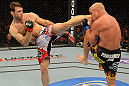 LAS VEGAS, NV - JULY 7:   (L-R) Forrest Griffin kicks Tito Ortiz during their light heavyweight bout at UFC 148 inside MGM Grand Garden Arena on July 7, 2012 in Las Vegas, Nevada.  (Photo by Donald Miralle/Zuffa LLC/Zuffa LLC via Getty Images)  *** Local Caption *** Tito Ortiz; Forrest Griffin