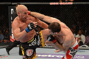 LAS VEGAS, NV - JULY 7:   (R-L) Forrest Griffin punches Tito Ortiz during their light heavyweight bout at UFC 148 inside MGM Grand Garden Arena on July 7, 2012 in Las Vegas, Nevada.  (Photo by Donald Miralle/Zuffa LLC/Zuffa LLC via Getty Images)  *** Local Caption *** Tito Ortiz; Forrest Griffin