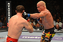 LAS VEGAS, NV - JULY 7:   (R-L) Tito Ortiz punches Forrest Griffin during their light heavyweight bout at UFC 148 inside MGM Grand Garden Arena on July 7, 2012 in Las Vegas, Nevada.  (Photo by Donald Miralle/Zuffa LLC/Zuffa LLC via Getty Images)  *** Local Caption *** Tito Ortiz; Forrest Griffin