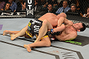 LAS VEGAS, NV - JULY 7:   (R-L) Forrest Griffin attempts to submit Tito Ortiz during their light heavyweight bout at UFC 148 inside MGM Grand Garden Arena on July 7, 2012 in Las Vegas, Nevada.  (Photo by Donald Miralle/Zuffa LLC/Zuffa LLC via Getty Images)  *** Local Caption *** Tito Ortiz; Forrest Griffin