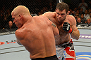 LAS VEGAS, NV - JULY 7:   (R-L) Forrest Griffin punches Tito Ortiz during their light heavyweight bout at UFC 148 inside MGM Grand Garden Arena on July 7, 2012 in Las Vegas, Nevada.  (Photo by Donald Miralle/Zuffa LLC/Zuffa LLC via Getty Images)  *** Local Caption *** Tito Ortiz; Forrest Griffin