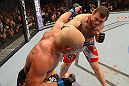 LAS VEGAS, NV - JULY 7:   (R-L) Forrest Griffin punches Tito Ortiz during their light heavyweight bout at UFC 148 inside MGM Grand Garden Arena on July 7, 2012 in Las Vegas, Nevada.  (Photo by Donald Miralle/Zuffa LLC/Zuffa LLC via Getty Images)  *** Local Caption *** Tito Ortiz; Forrest Griffin