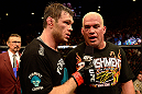 LAS VEGAS, NV - JULY 7:   (L-R) Forrest Griffin interviews Tito Ortiz after their light heavyweight bout at UFC 148 inside MGM Grand Garden Arena on July 7, 2012 in Las Vegas, Nevada.  (Photo by Donald Miralle/Zuffa LLC/Zuffa LLC via Getty Images)  *** Local Caption *** Tito Ortiz; Forrest Griffin