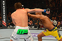 LAS VEGAS, NV - JULY 7:   (R-L) Anderson Silva punches Chael Sonnen during their UFC middleweight championship bout at UFC 148 inside MGM Grand Garden Arena on July 7, 2012 in Las Vegas, Nevada.  (Photo by Donald Miralle/Zuffa LLC/Zuffa LLC via Getty Images)  *** Local Caption *** Anderson Silva; Chael Sonnen