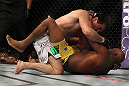LAS VEGAS, NV - JULY 7:   Chael Sonnen (top) punches Anderson Silva during their UFC middleweight championship bout at UFC 148 inside MGM Grand Garden Arena on July 7, 2012 in Las Vegas, Nevada.  (Photo by Josh Hedges/Zuffa LLC/Zuffa LLC via Getty Images)  *** Local Caption *** Anderson Silva; Chael Sonnen