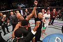 LAS VEGAS, NV - JULY 7:   Anderson Silva (left) reacts to being declared the winner in his fight against Chael Sonnen (white shirt, right) after their UFC middleweight championship bout at UFC 148 inside MGM Grand Garden Arena on July 7, 2012 in Las Vegas, Nevada.  (Photo by Josh Hedges/Zuffa LLC/Zuffa LLC via Getty Images)  *** Local Caption *** Anderson Silva; Chael Sonnen