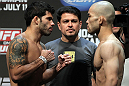 SAN JOSE, CA - JULY 10:   (L-R) Opponents Raphael Assuncao and Issei Tamura face off during the UFC on Fuel TV weigh in at HP Pavilion on July 10, 2012 in San Jose, California.  (Photo by Josh Hedges/Zuffa LLC/Zuffa LLC via Getty Images)