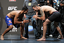 SAN JOSE, CA - JULY 10:   (L-R) Opponents Mark Munoz and Chris Weidman face off after making weight during the UFC on Fuel TV weigh in at HP Pavilion on July 10, 2012 in San Jose, California.  (Photo by Josh Hedges/Zuffa LLC/Zuffa LLC via Getty Images)