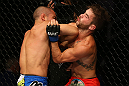 SAN JOSE, CA - JULY 11:   (L-R) Chris Cariaso elbows Josh Ferguson during their flyweight bout at HP Pavilion on July 11, 2012 in San Jose, California.  (Photo by Ezra Shaw/Zuffa LLC/Zuffa LLC via Getty Images)  *** Local Caption *** Chris Cariaso; Josh Ferguson