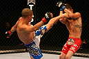 SAN JOSE, CA - JULY 11:   (L-R) Chris Cariaso kicks Josh Ferguson during their flyweight bout at HP Pavilion on July 11, 2012 in San Jose, California.  (Photo by Ezra Shaw/Zuffa LLC/Zuffa LLC via Getty Images)  *** Local Caption *** Chris Cariaso; Josh Ferguson