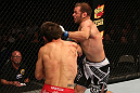 SAN JOSE, CA - JULY 11:   Kenny Robertson (right) punches Aaron Simpson during their welterweight bout at HP Pavilion on July 11, 2012 in San Jose, California.  (Photo by Ezra Shaw/Zuffa LLC/Zuffa LLC via Getty Images)  *** Local Caption *** Aaron Simpson; Kenny Robertson