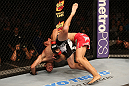 SAN JOSE, CA - JULY 11:   Aaron Simpson (red shorts) slams Kenny Robertson during their welterweight bout at HP Pavilion on July 11, 2012 in San Jose, California.  (Photo by Ezra Shaw/Zuffa LLC/Zuffa LLC via Getty Images)  *** Local Caption *** Aaron Simpson; Kenny Robertson