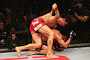 SAN JOSE, CA - JULY 11:   Aaron Simpson (red shorts) punches Kenny Robertson during their welterweight bout at HP Pavilion on July 11, 2012 in San Jose, California.  (Photo by Ezra Shaw/Zuffa LLC/Zuffa LLC via Getty Images)  *** Local Caption *** Aaron Simpson; Kenny Robertson