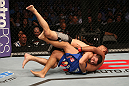 SAN JOSE, CA - JULY 11:   Chris Weidman (grey shorts) takes down Mark Munoz during their middleweight bout at HP Pavilion on July 11, 2012 in San Jose, California.  (Photo by Ezra Shaw/Zuffa LLC/Zuffa LLC via Getty Images)  *** Local Caption *** Mark Munoz; Chris Weidman