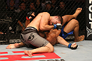 SAN JOSE, CA - JULY 11:   Chris Weidman (grey shorts) elbows Mark Munoz during their middleweight bout at HP Pavilion on July 11, 2012 in San Jose, California.  (Photo by Ezra Shaw/Zuffa LLC/Zuffa LLC via Getty Images)  *** Local Caption *** Mark Munoz; Chris Weidman