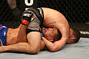 SAN JOSE, CA - JULY 11:   Chris Weidman (grey shorts) attempts to submit Mark Munoz during their middleweight bout at HP Pavilion on July 11, 2012 in San Jose, California.  (Photo by Ezra Shaw/Zuffa LLC/Zuffa LLC via Getty Images)  *** Local Caption *** Mark Munoz; Chris Weidman