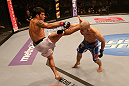 SAN JOSE, CA - JULY 11:   (L-R) Raphael Assuncao kicks Issei Tamura during their bantamweight bout at HP Pavilion on July 11, 2012 in San Jose, California.  (Photo by Ezra Shaw/Zuffa LLC/Zuffa LLC via Getty Images)  *** Local Caption *** Issei Tamura; Raphael Assuncao