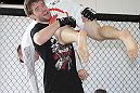 CALGARY, CANADA - JULY 18:  Mitch Clarke works out for the fans and media during the UFC 149 Open Workouts inside Champion's Creed Gym on July 18, 2012 in Calgary, Alberta, Canada.  (Photo by Jeff Bottari/Zuffa LLC/Zuffa LLC via Getty Images)