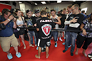 CALGARY, CANADA - JULY 18: Uriah Faber signs autographs after he works out for the fans and media during the UFC 149 Open Workouts inside Champion's Creed Gym on July 18, 2012 in Calgary, Alberta, Canada.  (Photo by Jeff Bottari/Zuffa LLC/Zuffa LLC via Getty Images)