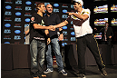 CALGARY, CANADA - JULY 19: Urijah Faber and Renan Barao shake hands after squaring off at the UFC 149 press conference at the Flames Central Sports Club on July 19, 2012 in Calgary, Alberta, Canada. (Photo by Jeff Bottari/Zuffa LLC/Zuffa LLC via Getty Images)