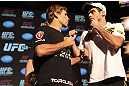CALGARY, CANADA - JULY 19: Urijah Faber and Renan Barao square off at the UFC 149 press conference at the Flames Central Sports Club on July 19, 2012 in Calgary, Alberta, Canada. (Photo by Jeff Bottari/Zuffa LLC/Zuffa LLC via Getty Images)