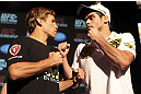 CALGARY, CANADA - JULY 19: Urijah Faber and Renan Barao square off at the UFC 149 press conference at the Flames Central Sports Club on July 19, 2012 in Calgary, Alberta, Canada. (Photo by Jeff Bottari/Zuffa LLC/Zuffa LLC via Getty Images)