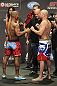 CALGARY, CANADA - JULY 20: Hector Lombard and Tim Boetsch face off at the UFC 149 weigh-in at the Scotiabank Saddledome on July 20, 2012 in Calgary, Alberta, Canada.  (Photo by Jeff Bottari/Zuffa LLC/Zuffa LLC via Getty Images)