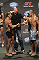 CALGARY, CANADA - JULY 20: Urijah Faber and Renan Barao shake hands after they face off at the UFC 149 weigh-in at the Scotiabank Saddledome on July 20, 2012 in Calgary, Alberta, Canada.  (Photo by Jeff Bottari/Zuffa LLC/Zuffa LLC via Getty Images)