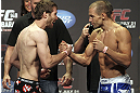 CALGARY, CANADA - JULY 20: Mitch Clarke and Anton Kuivanen face off at the UFC 149 weigh-in at the Scotiabank Saddledome on July 20, 2012 in Calgary, Alberta, Canada.  (Photo by Jeff Bottari/Zuffa LLC/Zuffa LLC via Getty Images)