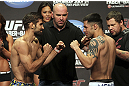 CALGARY, CANADA - JULY 20:  Antonio Carvalho and Daniel Pineda face off at the UFC 149 weigh-in at the Scotiabank Saddledome on July 20, 2012 in Calgary, Alberta, Canada.  (Photo by Jeff Bottari/Zuffa LLC/Zuffa LLC via Getty Images)