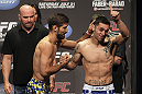CALGARY, CANADA - JULY 20:  Antonio Carvalho and Daniel Pineda face off at the UFC 149 weigh-in at the Scotiabank Saddledome on July 20, 2012 in Calgary, Alberta, Canada.  (Photo by Jeff Bottari/Zuffa LLC/Zuffa LLC via Getty Images)