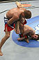 CALGARY, CANADA - JULY 21: (R-L) Mitch Clarke wraps around the leg of Anton Kuivanen during their lightweight bout at UFC 149 inside the Scotiabank Saddledome on July 21, 2012 in Calgary, Alberta, Canada.  (Photo by Nick Laham/Zuffa LLC/Zuffa LLC via Getty Images)