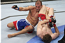 CALGARY, CANADA - JULY 21: (R-L) Mitch Clarke attempts an armbar against Anton Kuivanen during their lightweight bout at UFC 149 inside the Scotiabank Saddledome on July 21, 2012 in Calgary, Alberta, Canada.  (Photo by Nick Laham/Zuffa LLC/Zuffa LLC via Getty Images)