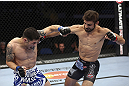 CALGARY, CANADA - JULY 21: (R-L) Antonio Carvalho lands a punch on Daniel Pineda during their featherweight bout at UFC 149 inside the Scotiabank Saddledome on July 21, 2012 in Calgary, Alberta, Canada.  (Photo by Nick Laham/Zuffa LLC/Zuffa LLC via Getty Images)