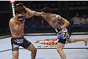CALGARY, CANADA - JULY 21: (R-L) Daniel Pineda throws a punch at Antonio Carvalho during their featherweight bout at UFC 149 inside the Scotiabank Saddledome on July 21, 2012 in Calgary, Alberta, Canada.  (Photo by Nick Laham/Zuffa LLC/Zuffa LLC via Getty Images)