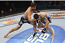 CALGARY, CANADA - JULY 21: (L-R) Antonio Carvalho lands a knockout punch on Daniel Pineda during their featherweight bout at UFC 149 inside the Scotiabank Saddledome on July 21, 2012 in Calgary, Alberta, Canada.  (Photo by Nick Laham/Zuffa LLC/Zuffa LLC via Getty Images)
