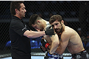 CALGARY, CANADA - JULY 21:  (L-R) Referee Mario Yamasaki holds Daniel Pineda up as Antonio Carvalho hugs him after knocking Pineda out in the first round during their featherweight bout at UFC 149 inside the Scotiabank Saddledome on July 21, 2012 in Calgary, Alberta, Canada.  (Photo by Nick Laham/Zuffa LLC/Zuffa LLC via Getty Images)