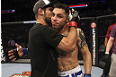 CALGARY, CANADA - JULY 21: (L-R) Antonio Carvalho hugs Daniel Pineda after Pineda was defeated by knockout in the first round during their featherweight bout at UFC 149 inside the Scotiabank Saddledome on July 21, 2012 in Calgary, Alberta, Canada.  (Photo by Nick Laham/Zuffa LLC/Zuffa LLC via Getty Images)