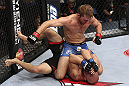 CALGARY, CANADA - JULY 21:  (L-R) Bryan Caraway powers over Mitch Gagnon during their bantamweight bout at UFC 149 inside the Scotiabank Saddledome on July 21, 2012 in Calgary, Alberta, Canada.  (Photo by Nick Laham/Zuffa LLC/Zuffa LLC via Getty Images)