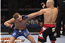 CALGARY, CANADA - JULY 21:  (R-L) Mitch Gagnon lands a punch on Bryan Caraway during their bantamweight bout at UFC 149 inside the Scotiabank Saddledome on July 21, 2012 in Calgary, Alberta, Canada.  (Photo by Nick Laham/Zuffa LLC/Zuffa LLC via Getty Images)