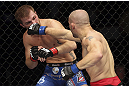 CALGARY, CANADA - JULY 21:  (R-L) Mitch Gagnon lands a punch on Bryan Caraway during their bantamweight bout at UFC 149 inside the Scotiabank Saddledome on July 21, 2012 in Calgary, Alberta, Canada.  (Photo by Nick Laham/Zuffa LLC/Zuffa LLC via Getty Images)