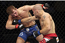 CALGARY, CANADA - JULY 21: (R-L) Mitch Gagnon lands a punch on Bryan Caraway during their bantamweight bout at UFC 149 inside the Scotiabank Saddledome on July 21, 2012 in Calgary, Alberta, Canada.  (Photo by Nick Laham/Zuffa LLC/Zuffa LLC via Getty Images)