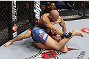 CALGARY, CANADA - JULY 21:  (L-R) Mitch Gagnon powers over Bryan Caraway during their bantamweight bout at UFC 149 inside the Scotiabank Saddledome on July 21, 2012 in Calgary, Alberta, Canada.  (Photo by Nick Laham/Zuffa LLC/Zuffa LLC via Getty Images)