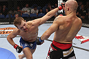 CALGARY, CANADA - JULY 21: (L-R) Bryan Caraway lands a punch on Mitch Gagnon during their bantamweight bout at UFC 149 inside the Scotiabank Saddledome on July 21, 2012 in Calgary, Alberta, Canada.  (Photo by Nick Laham/Zuffa LLC/Zuffa LLC via Getty Images)