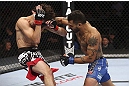 CALGARY, CANADA - JULY 21:  (R-L) Francisco Rivera lands a punch to the head of Roland Delorme during their bantamweight bout at UFC 149 inside the Scotiabank Saddledome on July 21, 2012 in Calgary, Alberta, Canada.  (Photo by Nick Laham/Zuffa LLC/Zuffa LLC via Getty Images)
