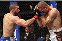 CALGARY, CANADA - JULY 21: (L-R) Court McGee throws a punch at Nick Ring during their middleweight bout at UFC 149 inside the Scotiabank Saddledome on July 21, 2012 in Calgary, Alberta, Canada.  (Photo by Nick Laham/Zuffa LLC/Zuffa LLC via Getty Images)