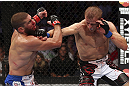CALGARY, CANADA - JULY 21: (R-L) Nick Ring lands a punch to the head of Court McGee during their middleweight bout at UFC 149 inside the Scotiabank Saddledome on July 21, 2012 in Calgary, Alberta, Canada.  (Photo by Nick Laham/Zuffa LLC/Zuffa LLC via Getty Images)