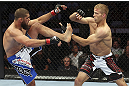 CALGARY, CANADA - JULY 21: (L-R) Court McGee exchanges contact with Nick Ring during their middleweight bout at UFC 149 inside the Scotiabank Saddledome on July 21, 2012 in Calgary, Alberta, Canada.  (Photo by Nick Laham/Zuffa LLC/Zuffa LLC via Getty Images)